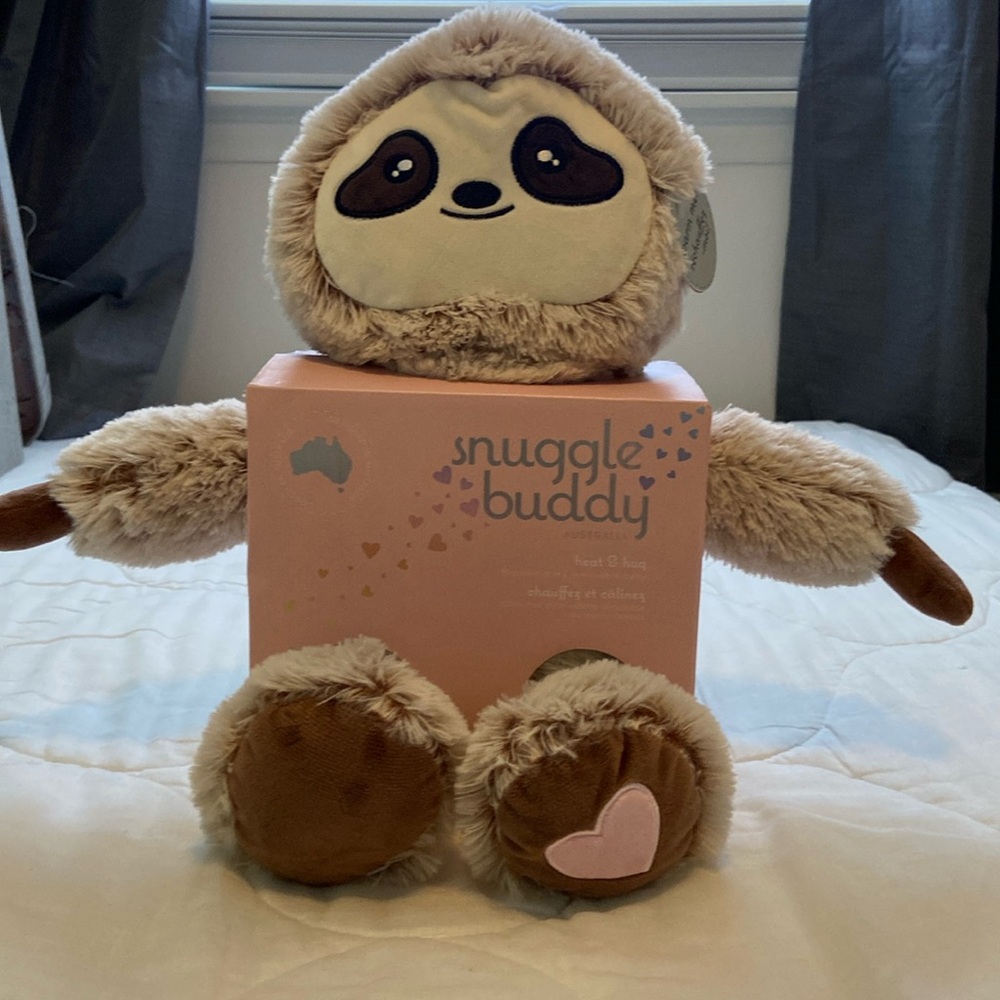 Warming plush sloth.   NWT